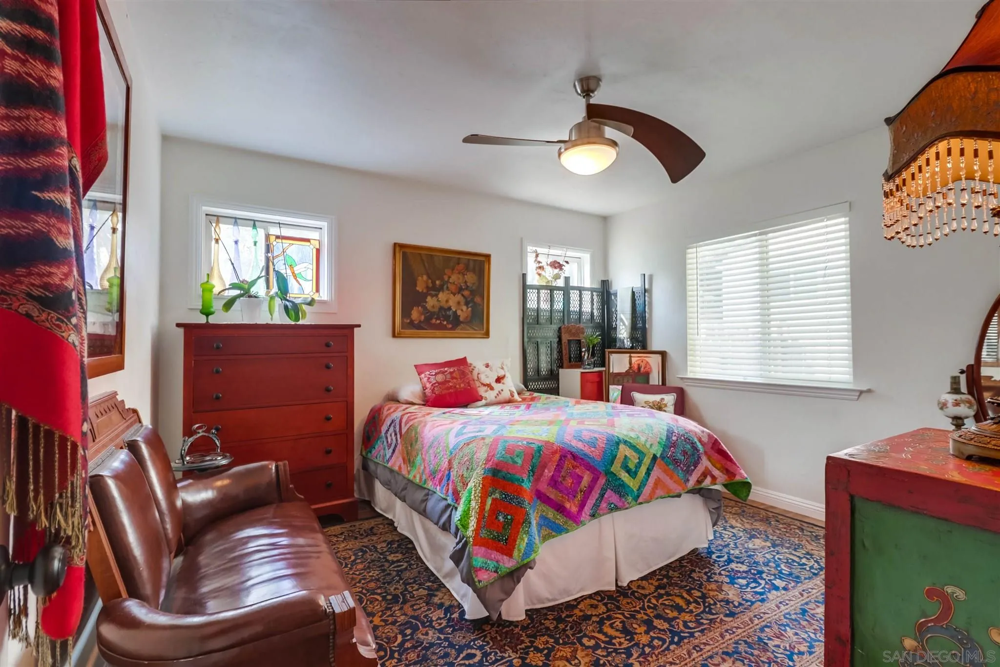 10436 Don Pico Road Spring Valley, CA 91978 - Photo 12 of 25 a bedroom with a bed couch and windows