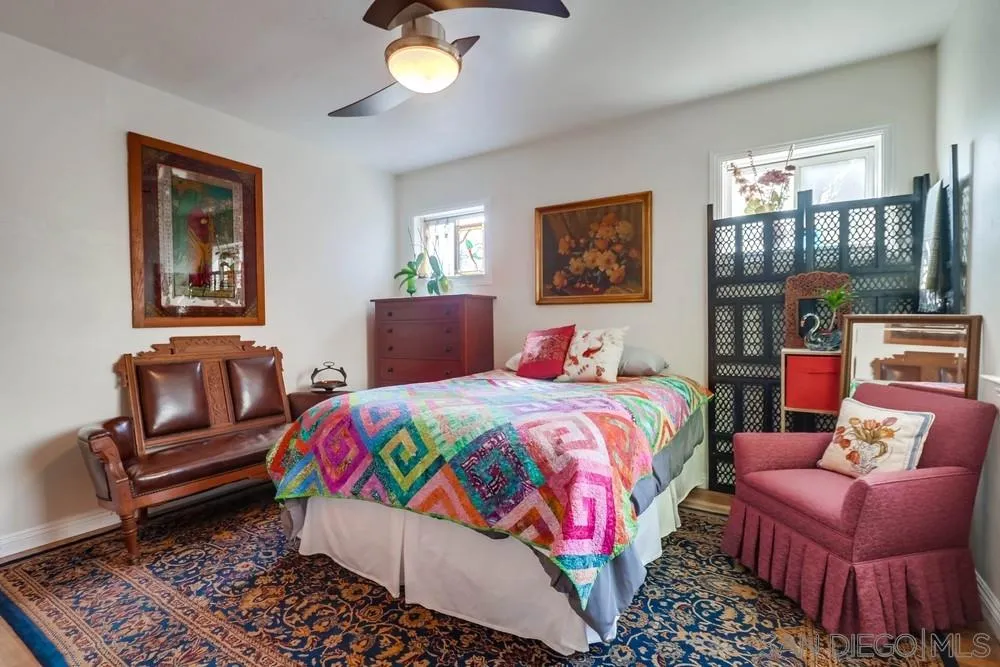 10436 Don Pico Road Spring Valley, CA 91978 - Photo 13 of 25 a bedroom with a bed and wooden floor