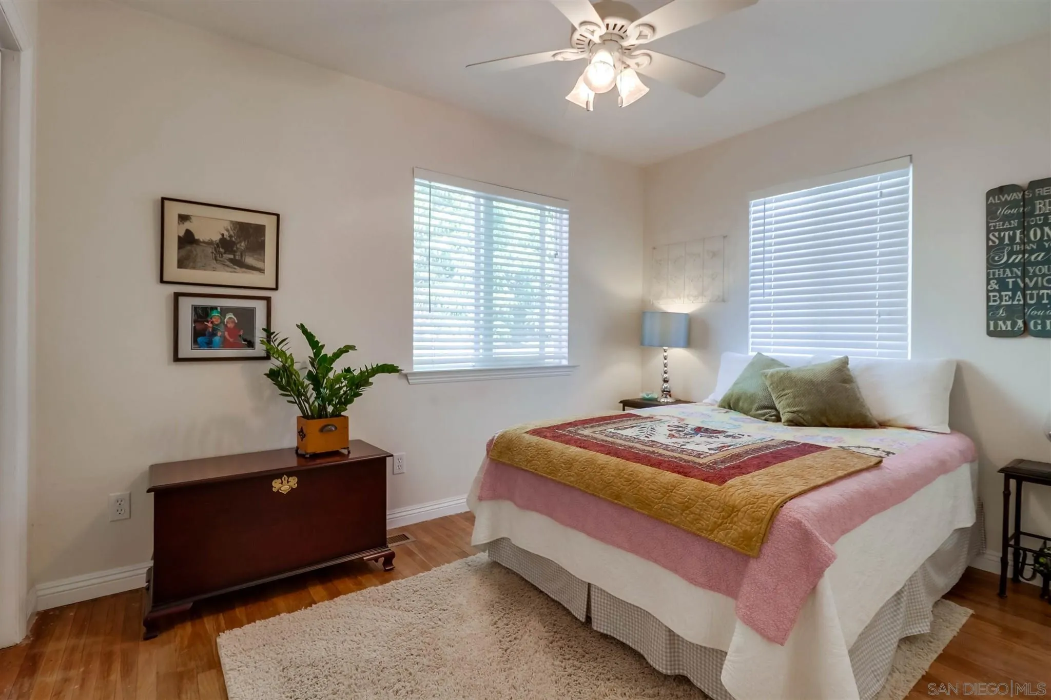 10436 Don Pico Road Spring Valley, CA 91978 - Photo 14 of 25 a bedroom with a bed and a potted plant on the dresser