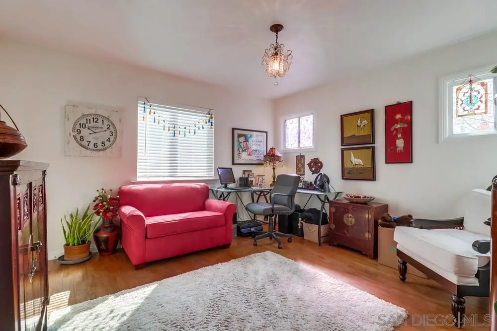 10436 Don Pico Road Spring Valley, CA 91978 - Photo 16 of 25 a living room with furniture a window and a bookshelf