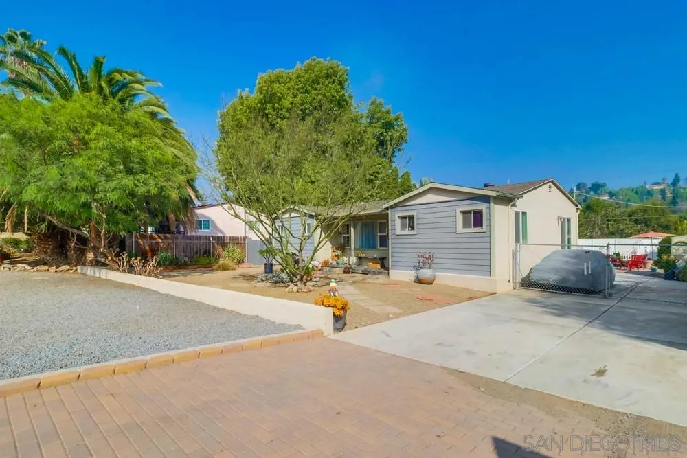 10436 Don Pico Road Spring Valley, CA 91978 - Photo 2 of 25 a view of a white house with swimming pool and sitting area