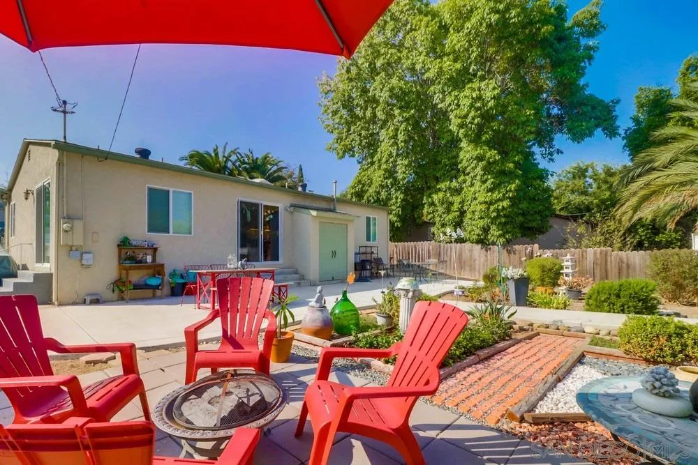 10436 Don Pico Road Spring Valley, CA 91978 - Photo 21 of 25 a view of a patio with table and chairs potted plants with wooden fence