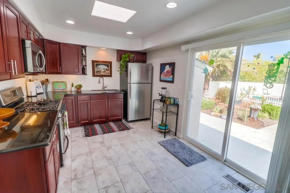 10436 Don Pico Road Spring Valley, CA 91978 - Photo 9 of 25 a large bedroom with a large bed and furniture