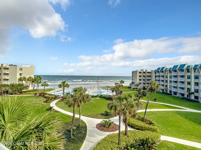 a view of a swimming pool and a chairs