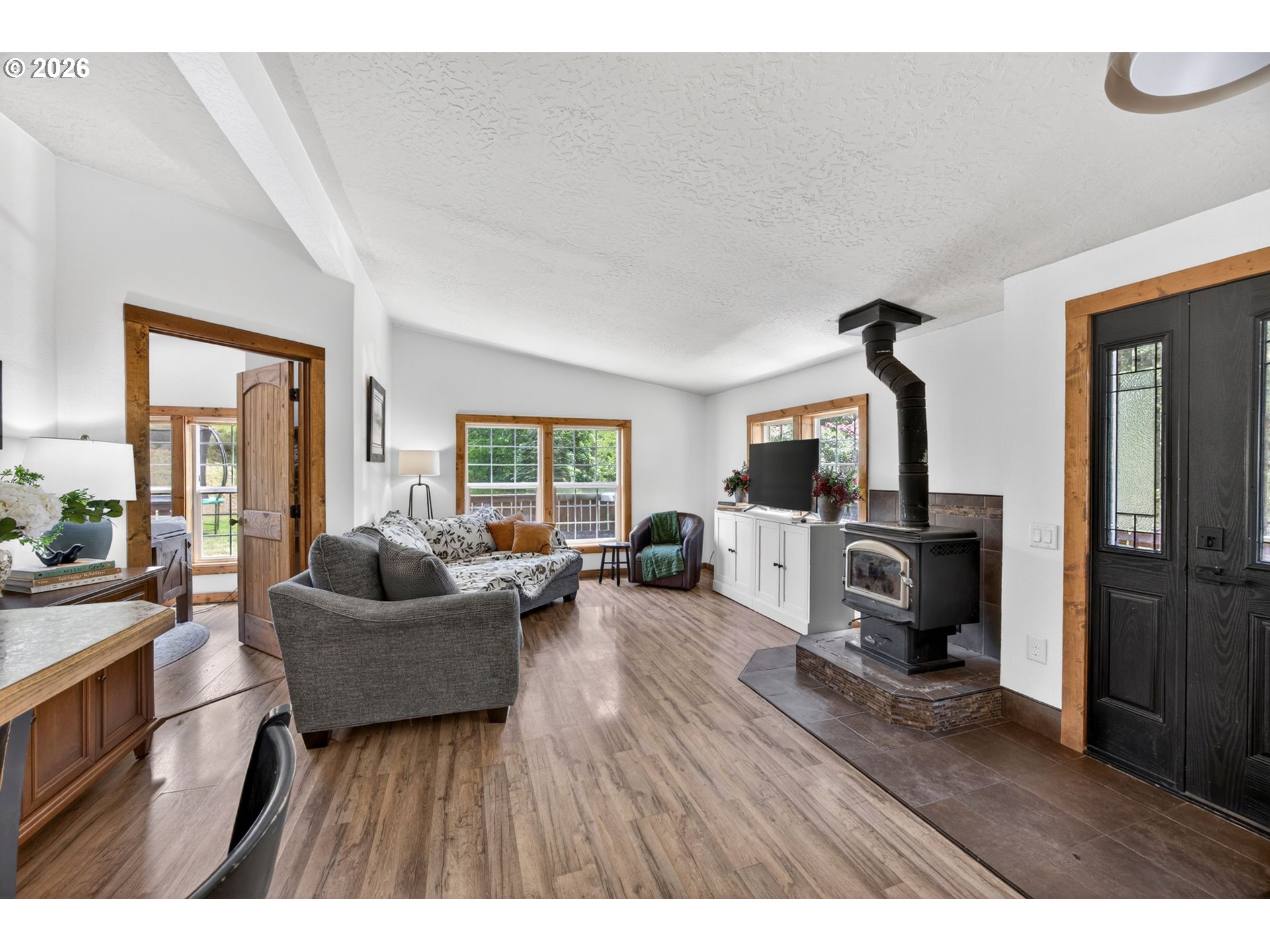 6895 Canary Road Westlake, OR 97493 - Photo 11 of 40 a living room with furniture and a flat screen tv