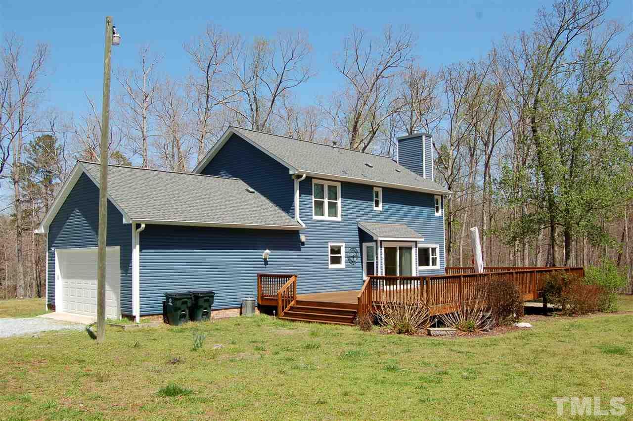 300 Barclay Road Durham, NC 27712 - Photo 23 of 25 a view of a house with a yard patio and fire pit