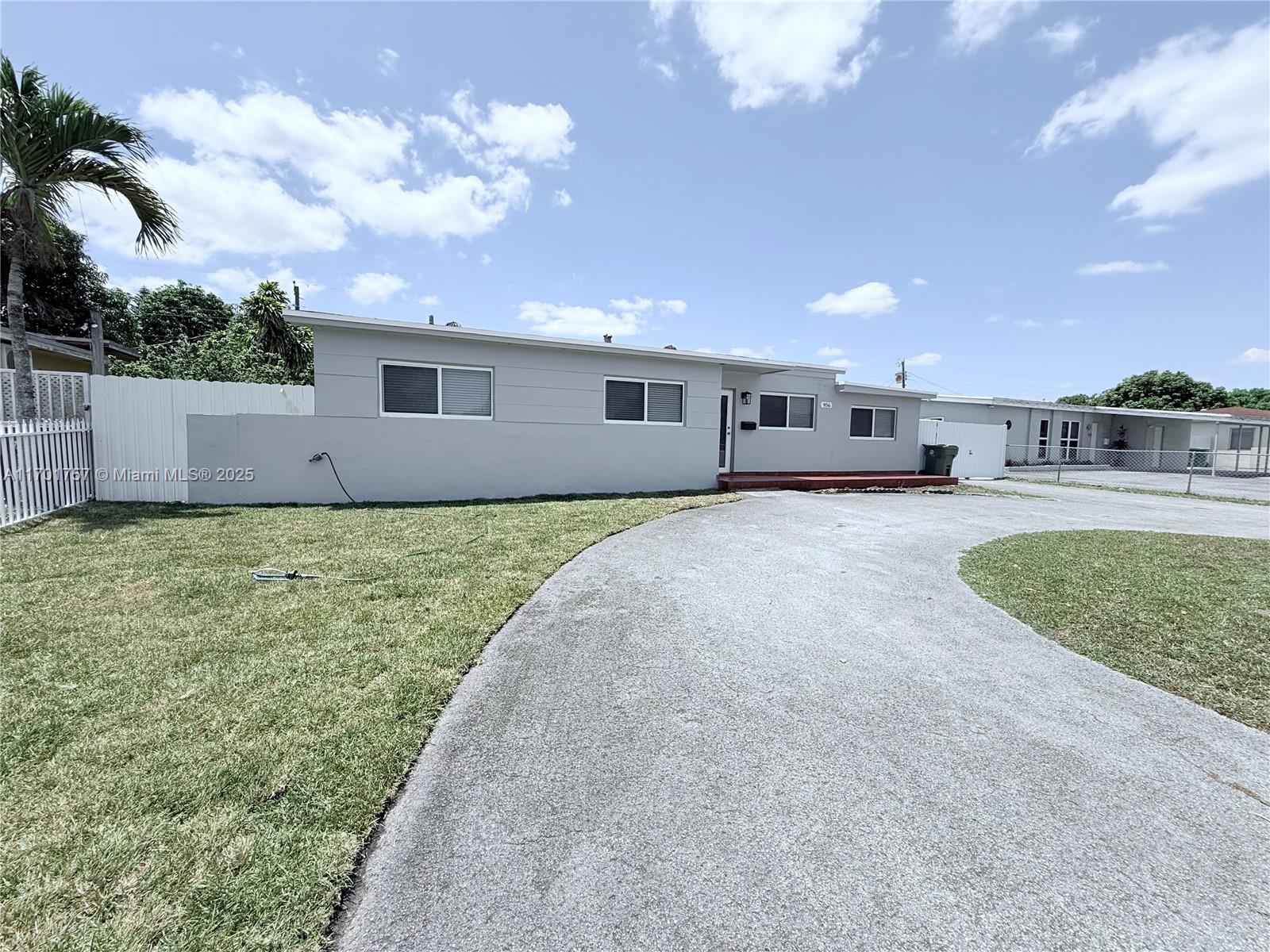 a swimming pool with outdoor seating and yard