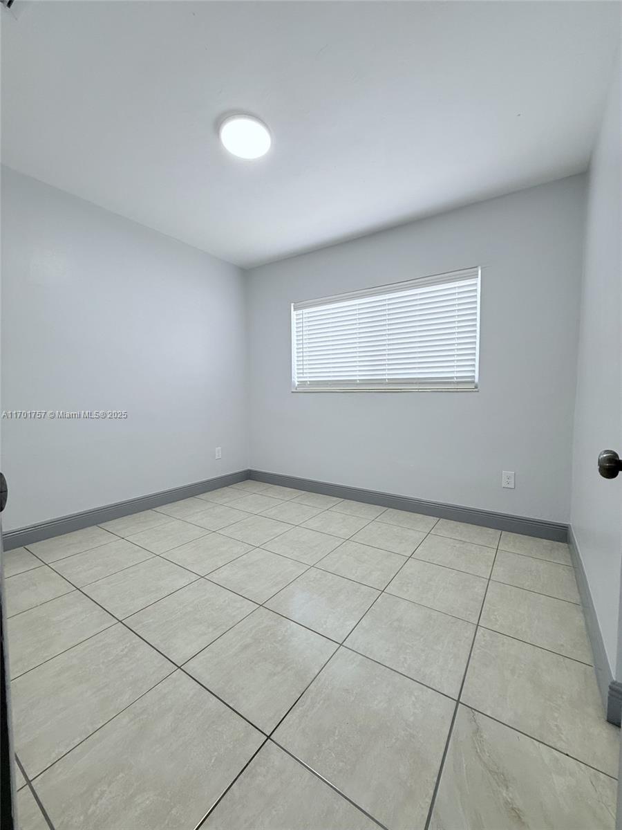 956 West 68th Street Hialeah, FL 33014 - Photo 16 of 21 a view of a room with windows