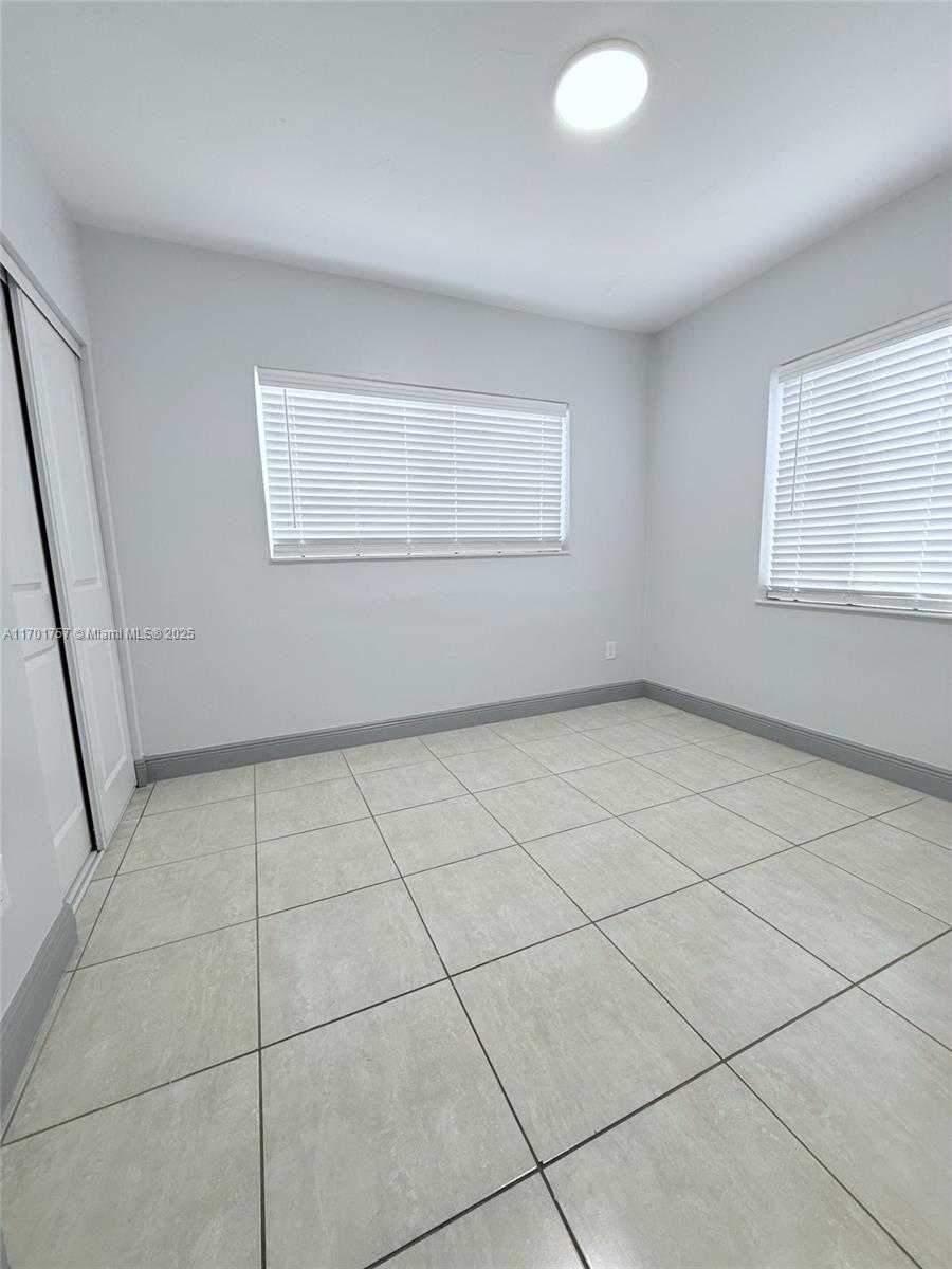 956 West 68th Street Hialeah, FL 33014 - Photo 17 of 21 a view of an empty room with a window