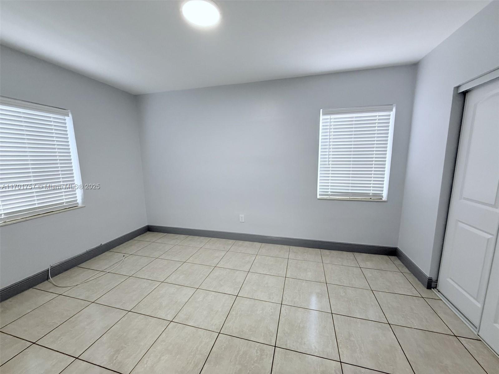 956 West 68th Street Hialeah, FL 33014 - Photo 18 of 21 a view of an empty room with a window