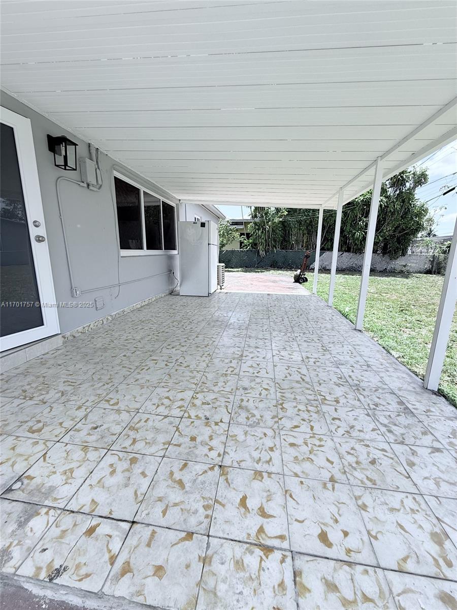 956 West 68th Street Hialeah, FL 33014 - Photo 20 of 21 a view of a house with a backyard
