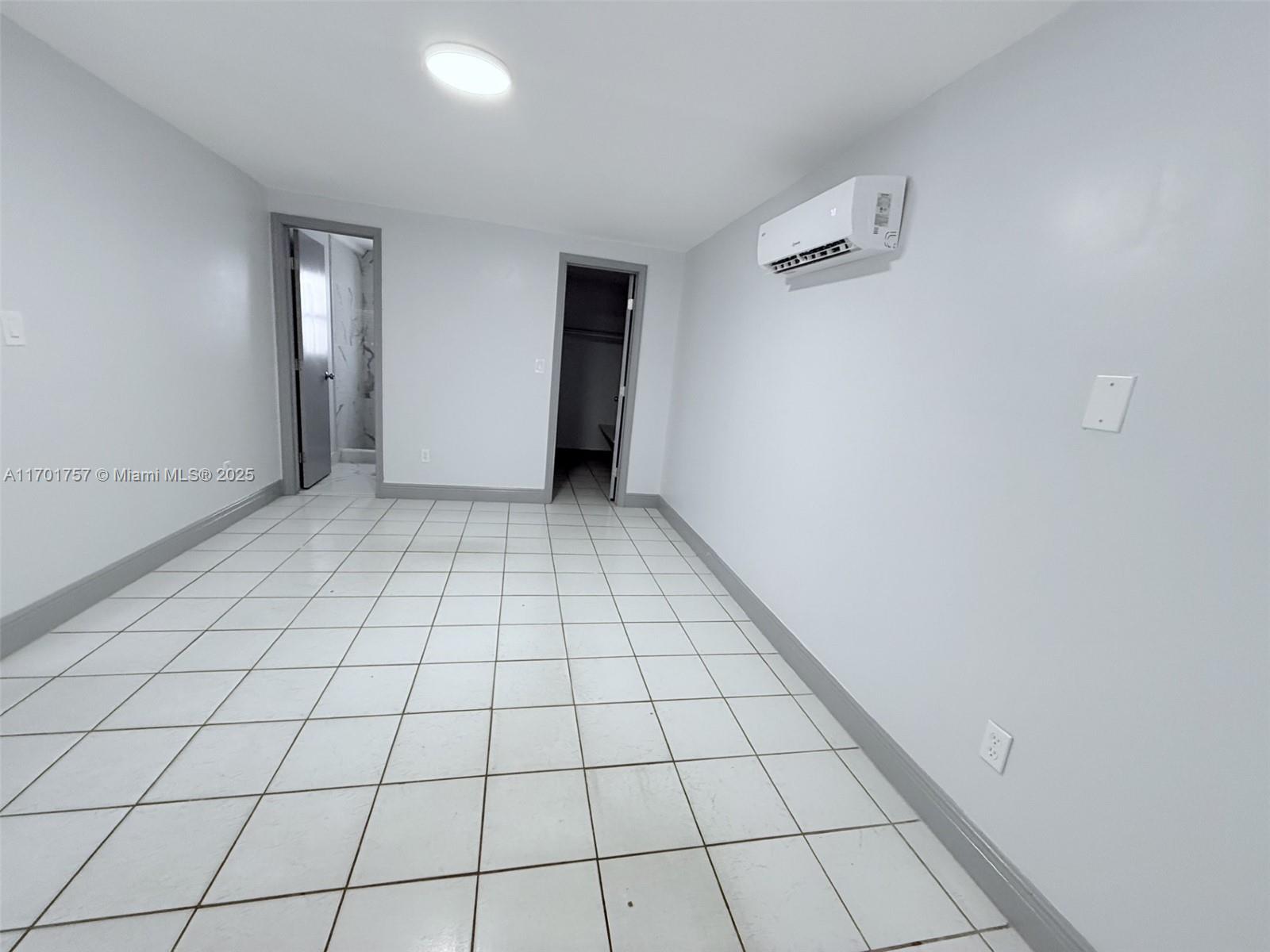 956 West 68th Street Hialeah, FL 33014 - Photo 6 of 21 a view of an empty room and window