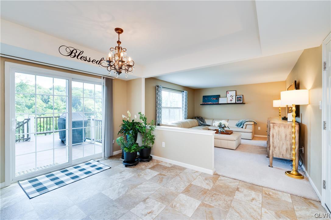 238 Longview Drive Reading, PA 19608 - Photo 17 of 43 a living room with furniture and a chandelier