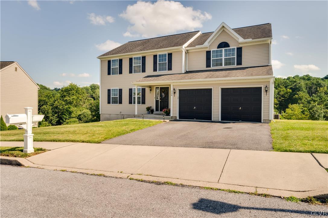 238 Longview Drive Reading, PA 19608 - Photo 2 of 43 a view of a white house with a yard and plants