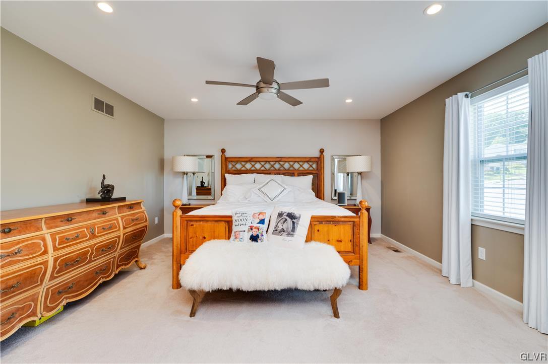 238 Longview Drive Reading, PA 19608 - Photo 23 of 43 a bedroom with a bed and wooden floor