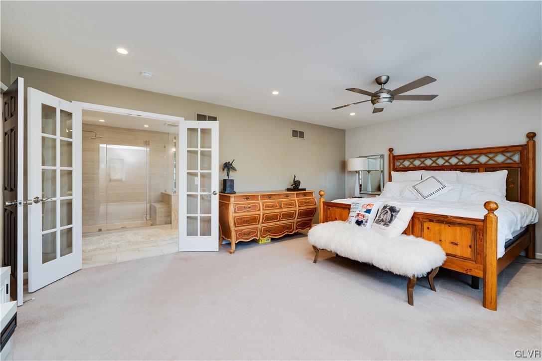 238 Longview Drive Reading, PA 19608 - Photo 24 of 43 a bedroom with furniture and a chandelier