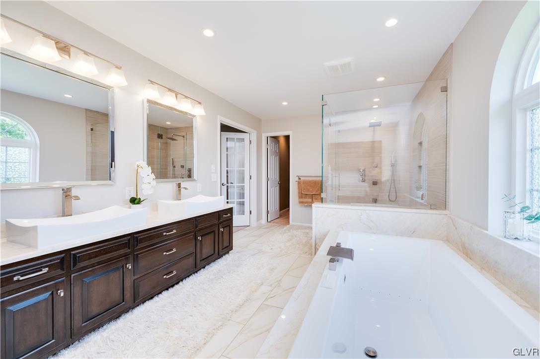 238 Longview Drive Reading, PA 19608 - Photo 28 of 43 a spacious bathroom with a tub sink double vanity and mirror