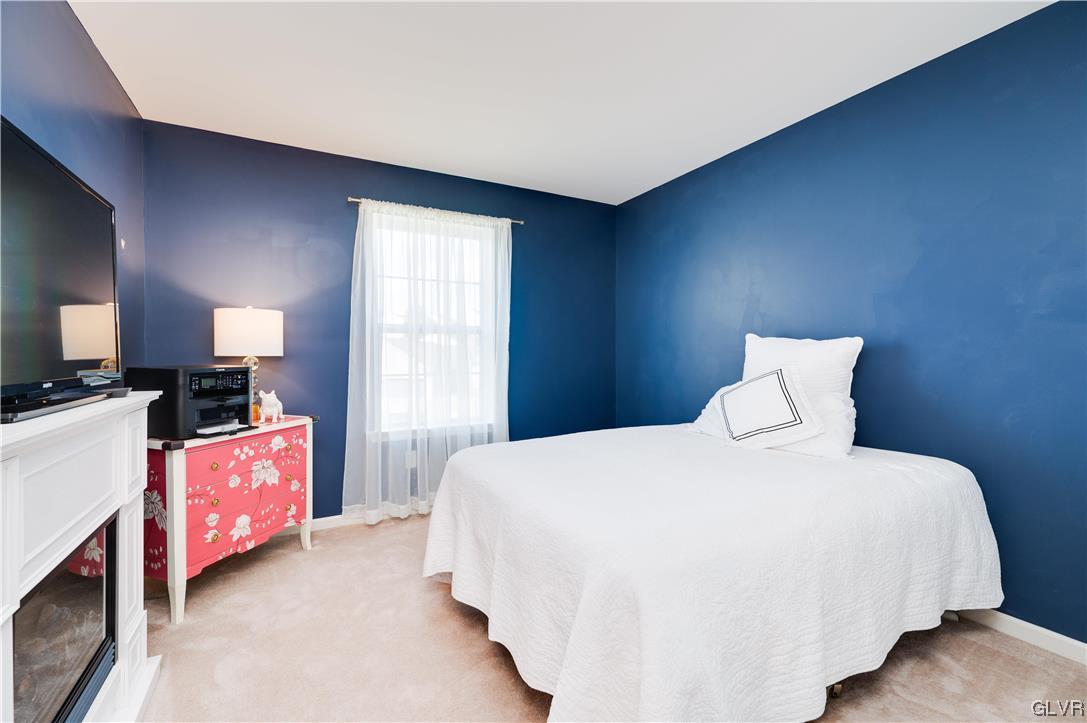 238 Longview Drive Reading, PA 19608 - Photo 33 of 43 a spacious bedroom with a bed and a dresser in it