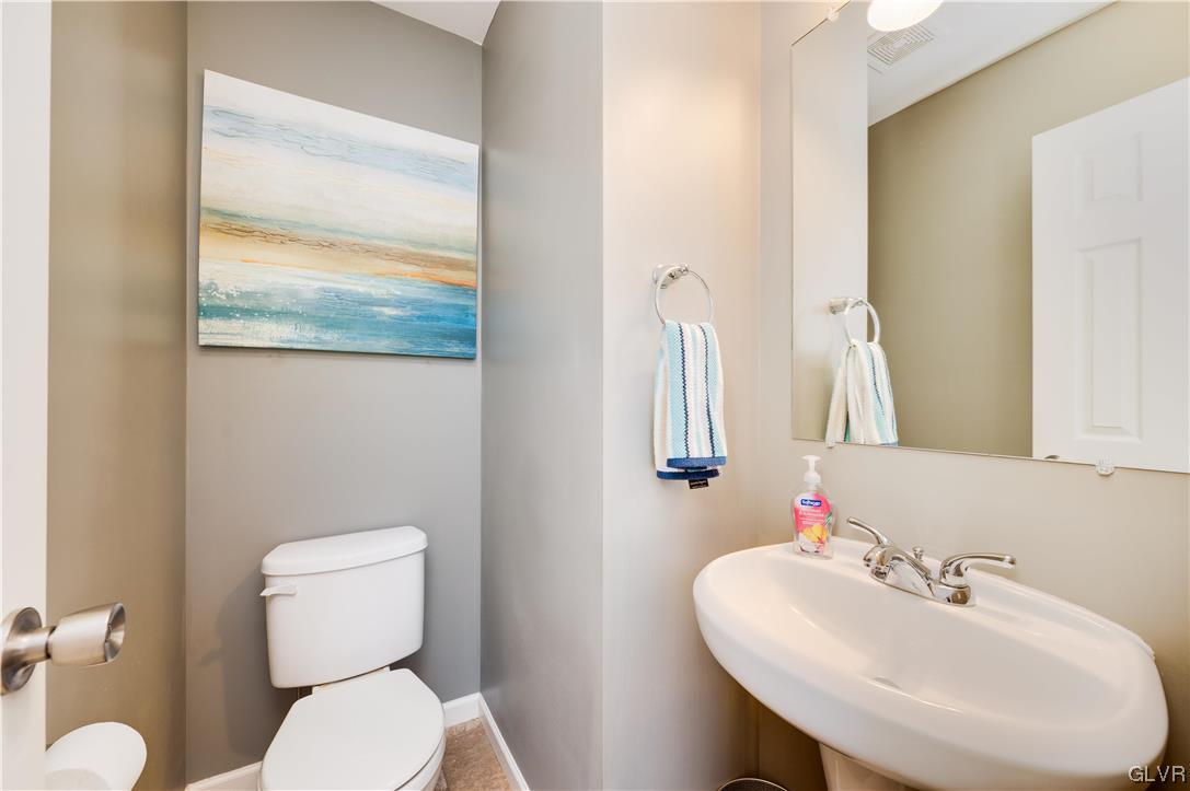 238 Longview Drive Reading, PA 19608 - Photo 6 of 43 a bathroom with a toilet sink and mirror