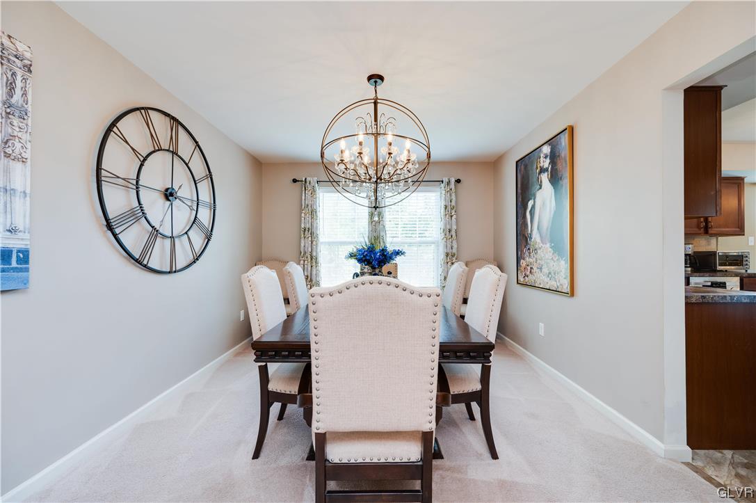 238 Longview Drive Reading, PA 19608 - Photo 10 of 43 a dining room with furniture a chandelier and a window