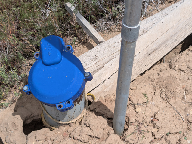 11799 Cove Creek Road Mount Pleasant, UT 84647 - Photo 12 of 15 Blue capped water well with a galvanized metal pipe and wood planking