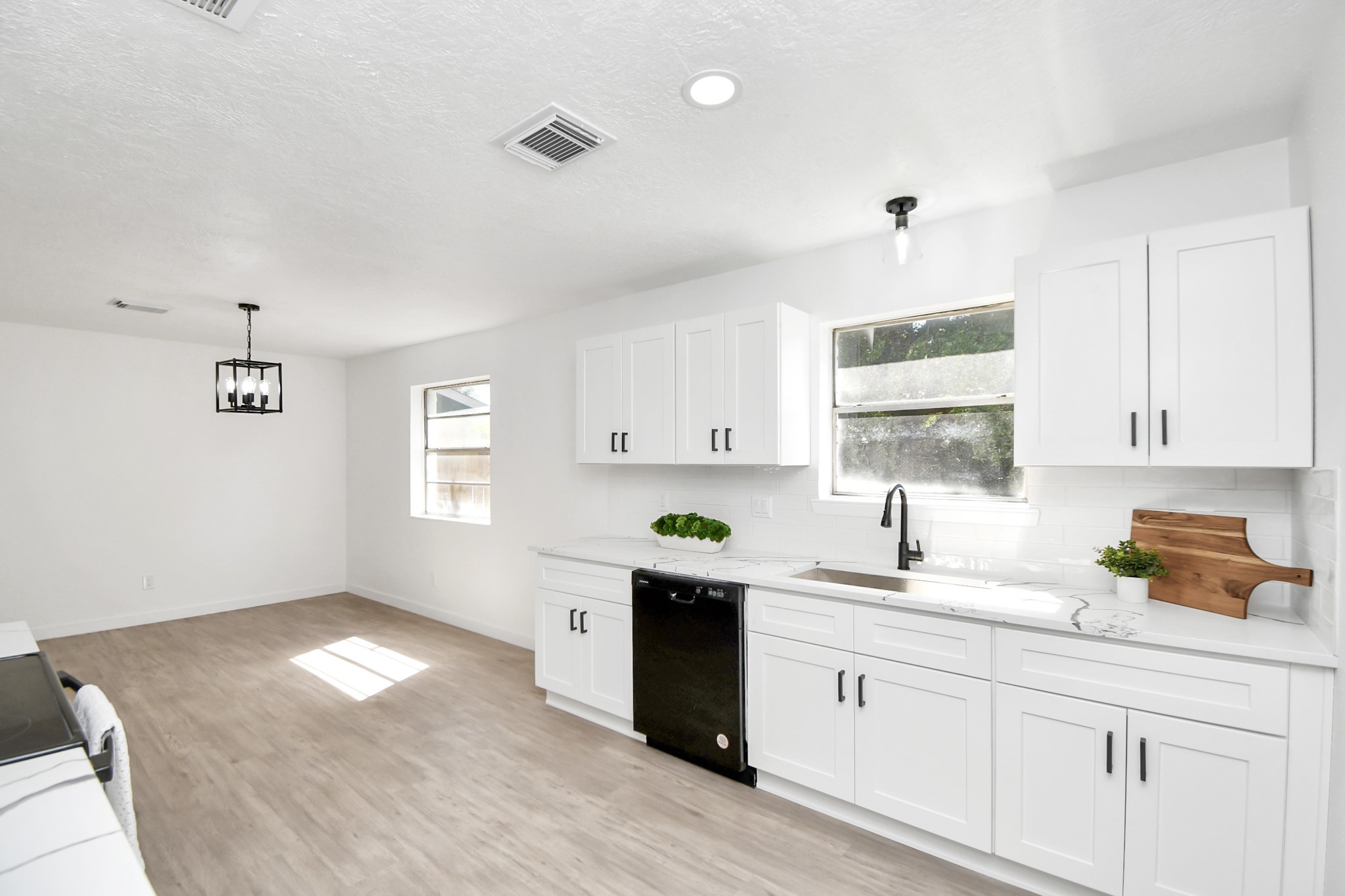 9912 Cardinal Street La Porte, TX 77571 - Photo 12 of 34 a kitchen with a sink cabinets and window