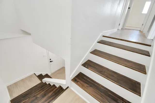 an empty room with a ceiling fan