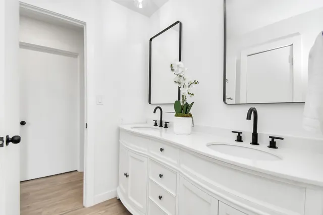 a view of a room with a ceiling fan