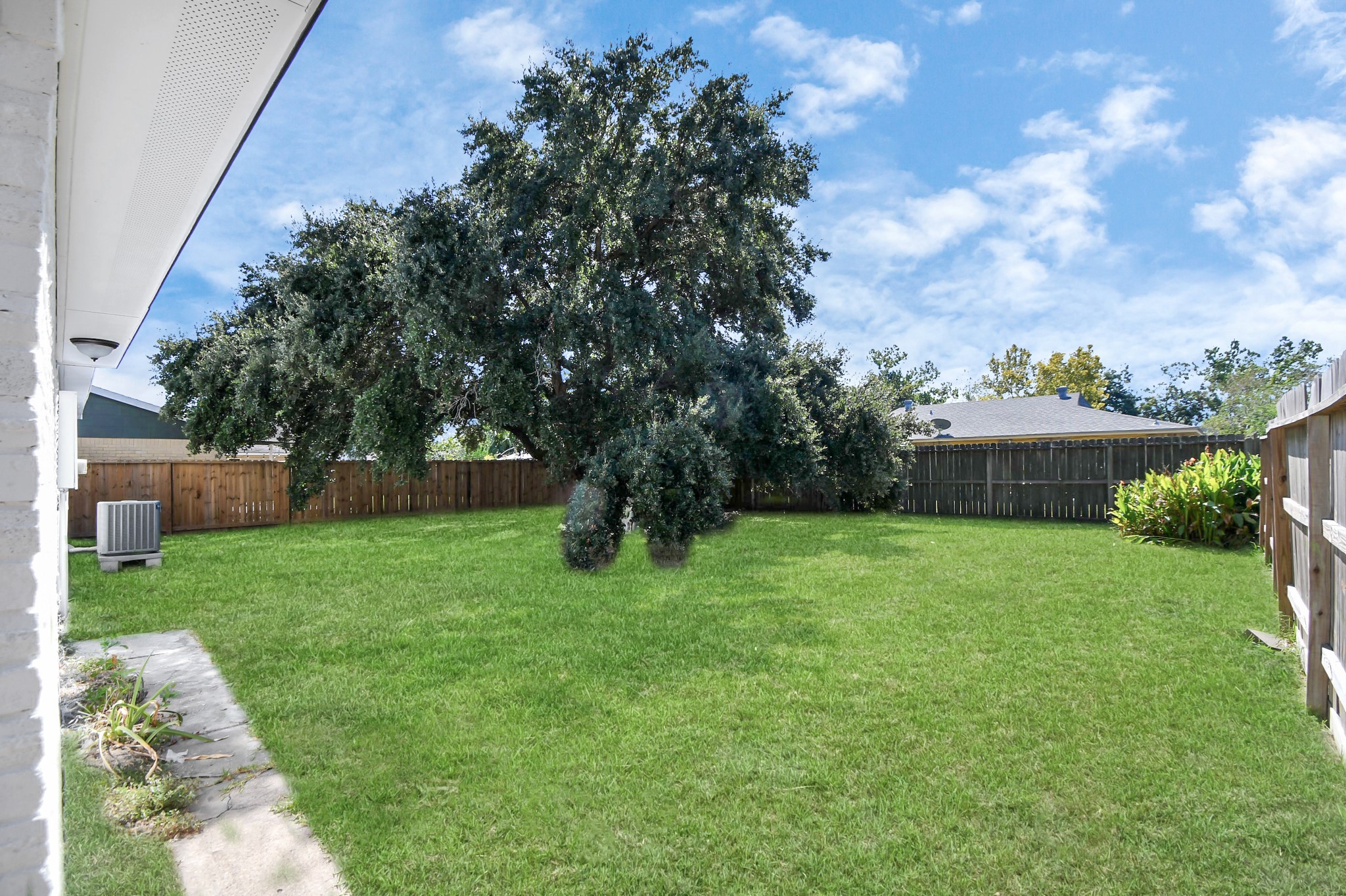 9912 Cardinal Street La Porte, TX 77571 - Photo 27 of 34 a big yard with lots of green space