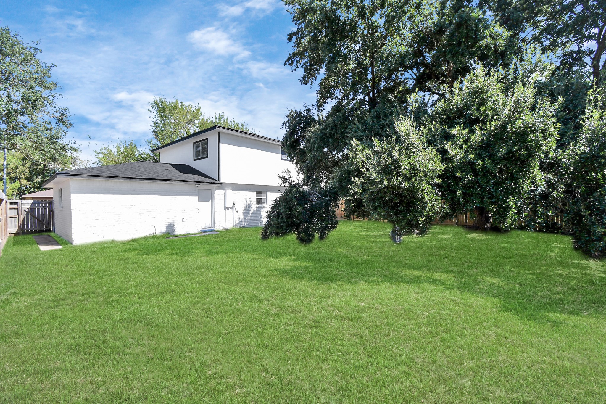 9912 Cardinal Street La Porte, TX 77571 - Photo 28 of 34 a view of a backyard with large trees