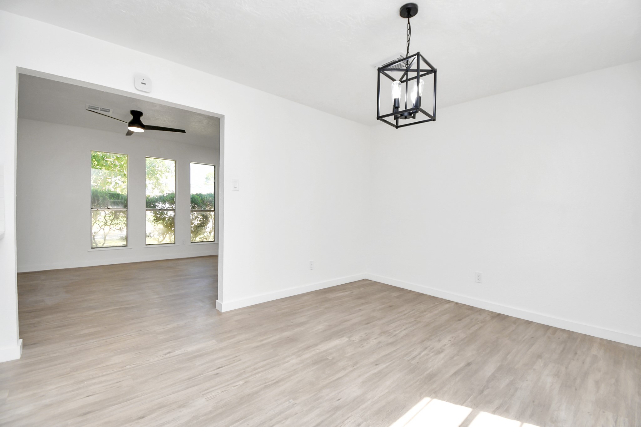 9912 Cardinal Street La Porte, TX 77571 - Photo 9 of 34 a room with wooden floor and windows