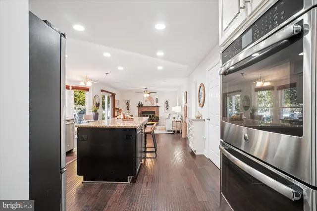a living room with furniture a fireplace and a table