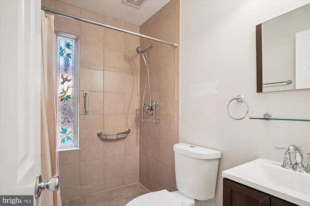 a view of room with window and ceiling fan