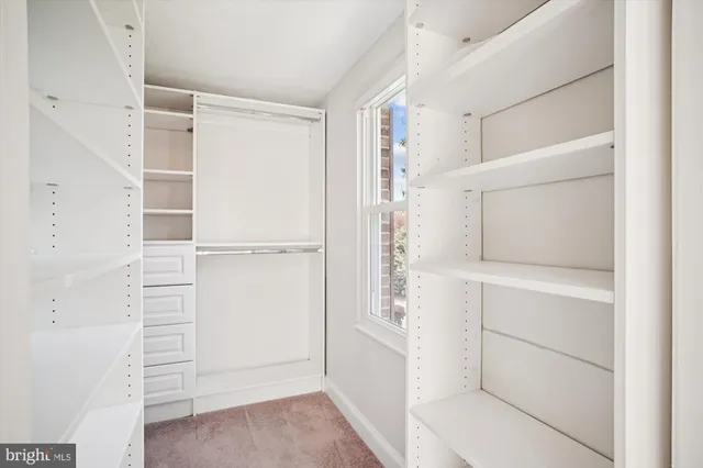 a bathroom with a shower and a glass door