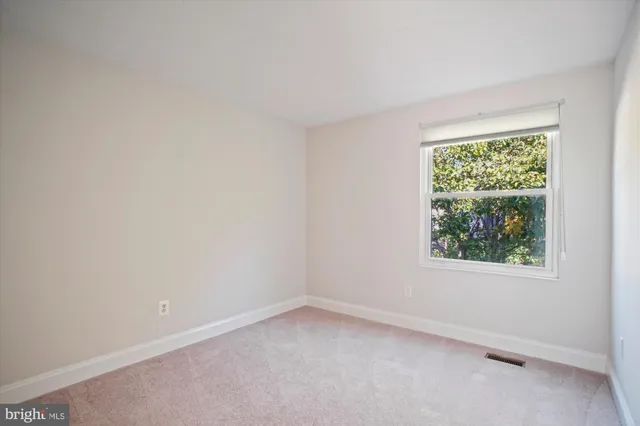 a view of a livingroom with a camera and window