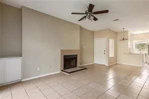 a view of an empty room with a fireplace