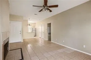 a view of a kitchen with a sink and a refrigerator