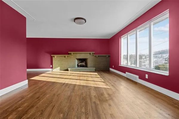 a view of livingroom with furniture wooden floor and window
