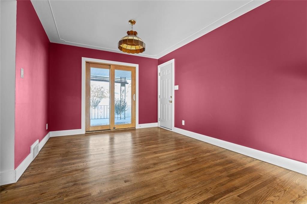 628 Marple Avenue Canonsburg, PA 15317 - Photo 7 of 18 a view of an empty room with window and wooden floor