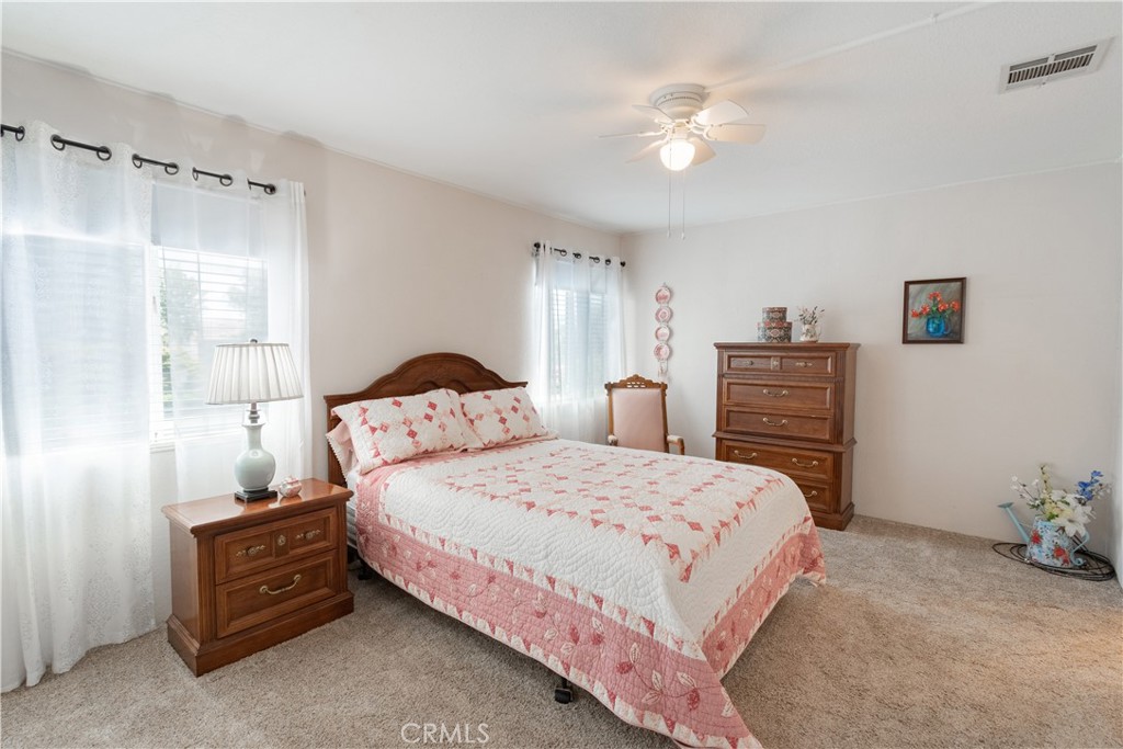 342 Bobwhite Drive Paso Robles, CA 93446 - Photo 11 of 35 a bedroom with a bed and a chandelier
