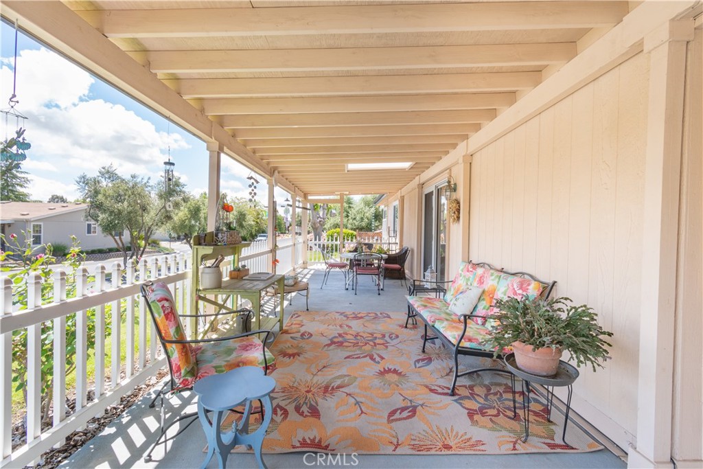 342 Bobwhite Drive Paso Robles, CA 93446 - Photo 3 of 35 a view of a patio with dining table and chairs potted plants with wooden floor and seating space