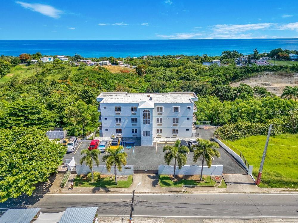 413 Camino Carretas, Unit A7 Rincon, Rincón 00677 - Photo 2 of 23 a view of a terrace with a ocean view