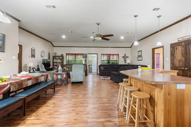 a large room with lots of furniture and painting on the wall