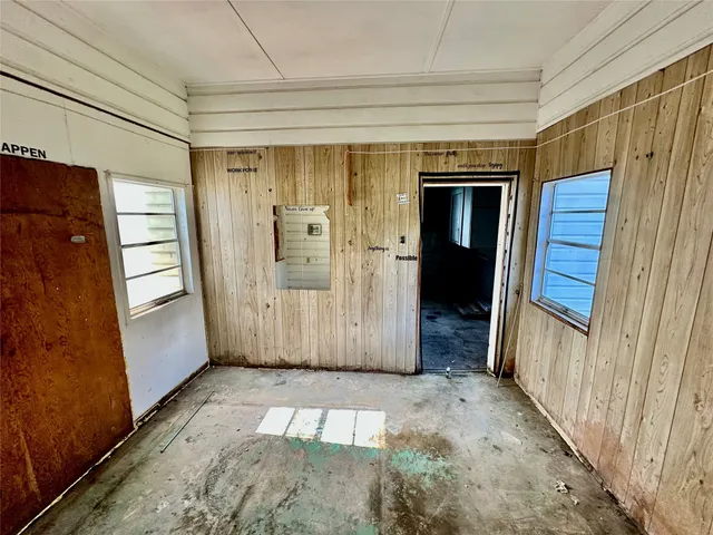 a view of entryway with wooden floor and stairs