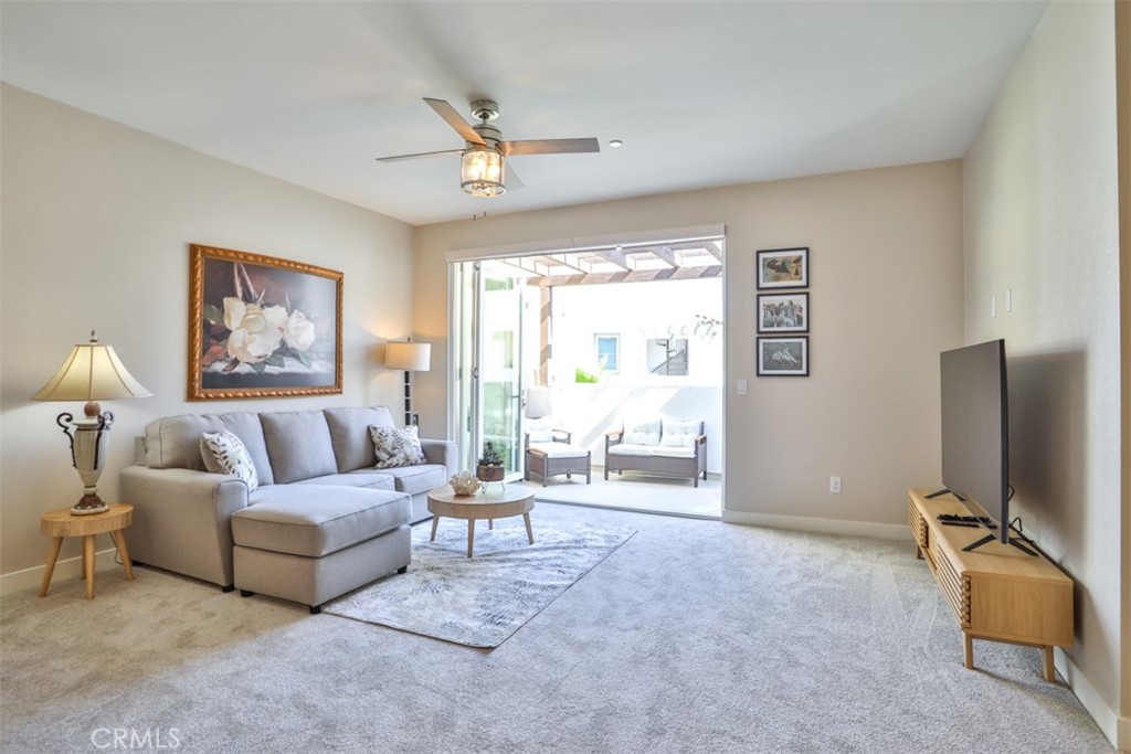 3318 Doheny Way Dana Point, CA 92629 - Photo 11 of 55 a living room with furniture and a flat screen tv