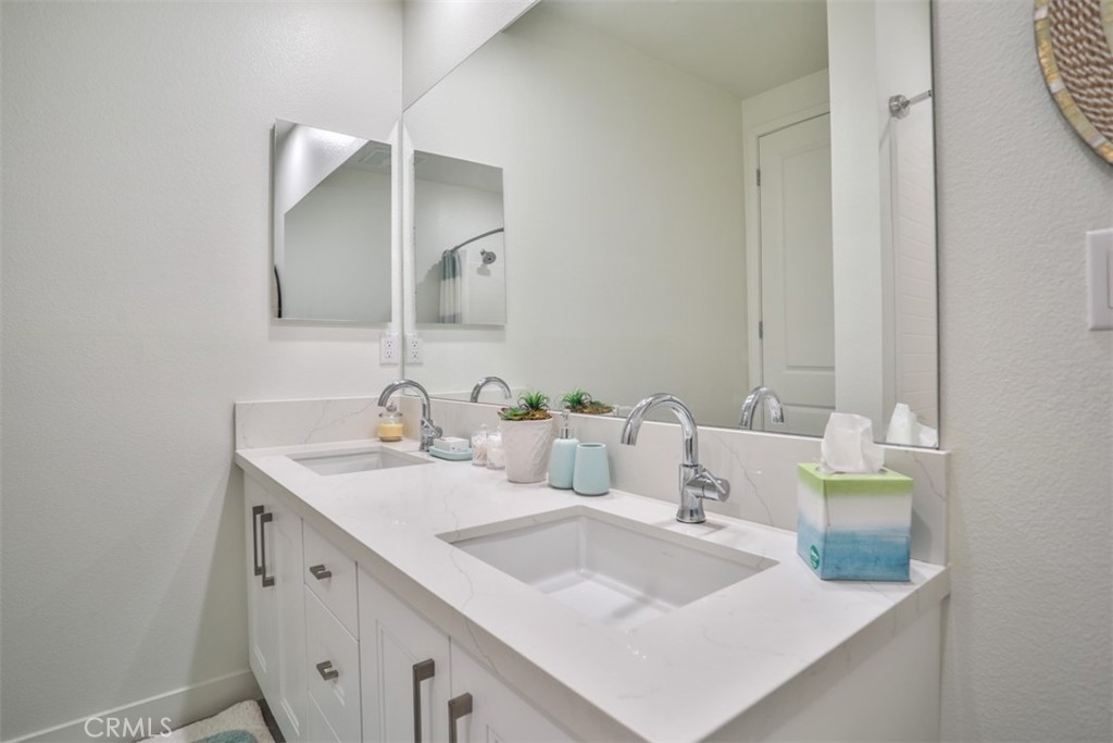3318 Doheny Way Dana Point, CA 92629 - Photo 51 of 55 a bathroom with a sink and a mirror
