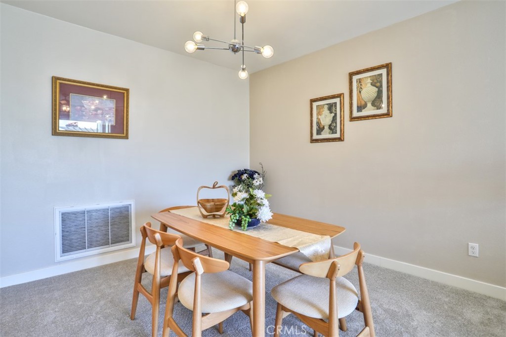 3318 Doheny Way Dana Point, CA 92629 - Photo 8 of 55 a view of a dining room with furniture and chandelier