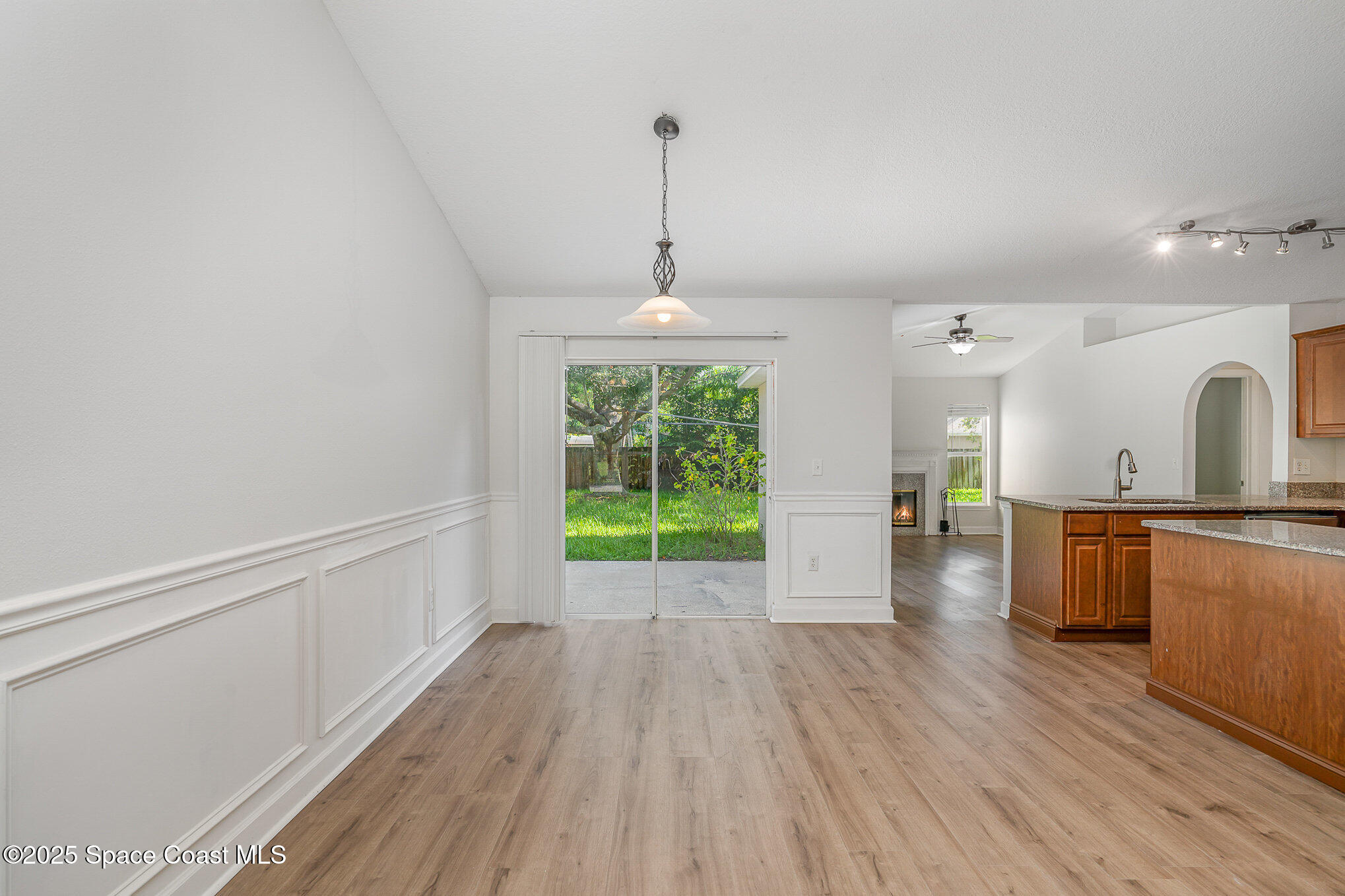 2143 Lansing Street Melbourne, FL 32935 - Photo 11 of 26 a view of a room with wooden floor a sink and windows