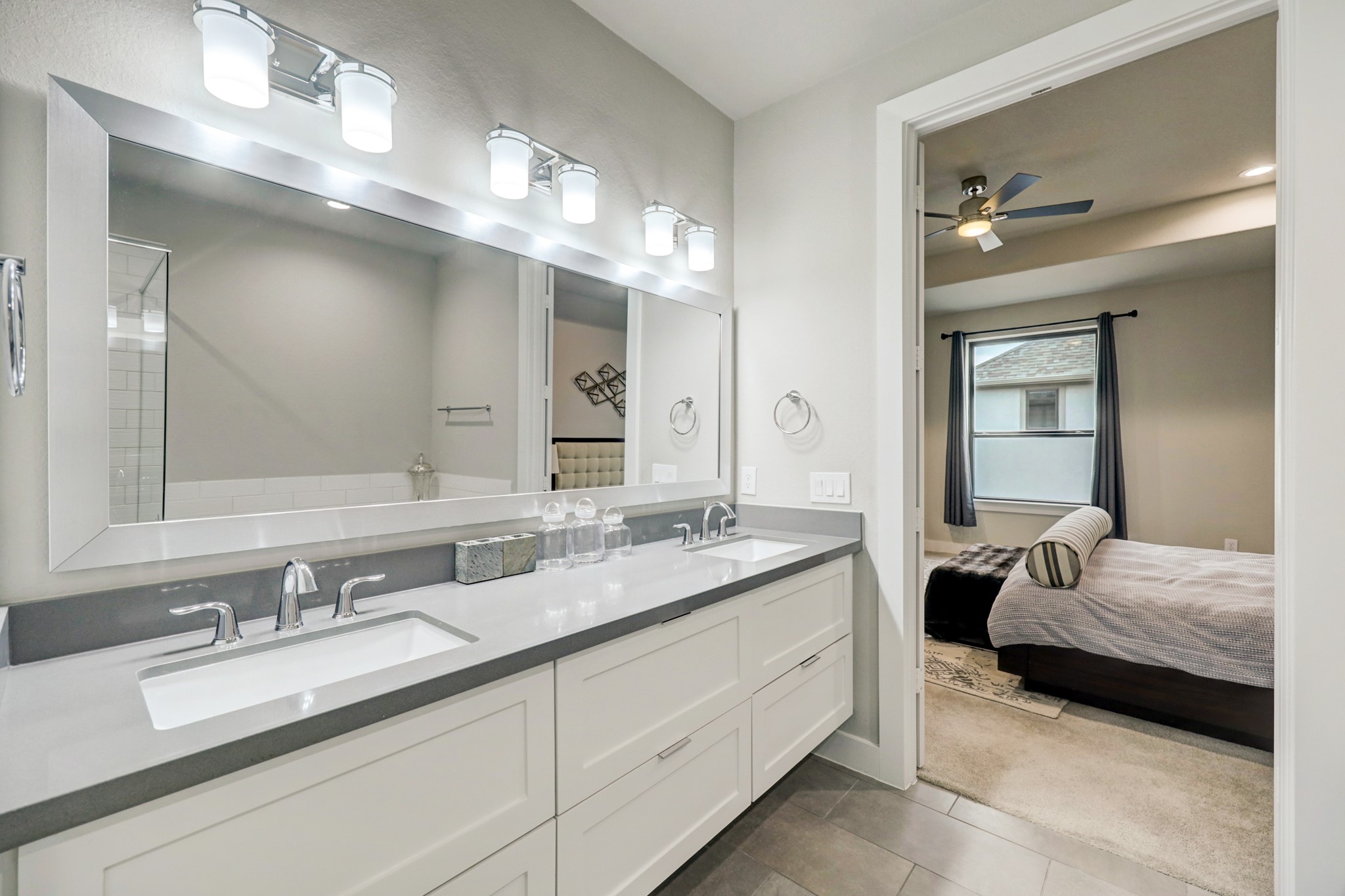 4203 Allen Street Houston, TX 77007 - Photo 27 of 35 a en suite bathroom with double sink and a mirror