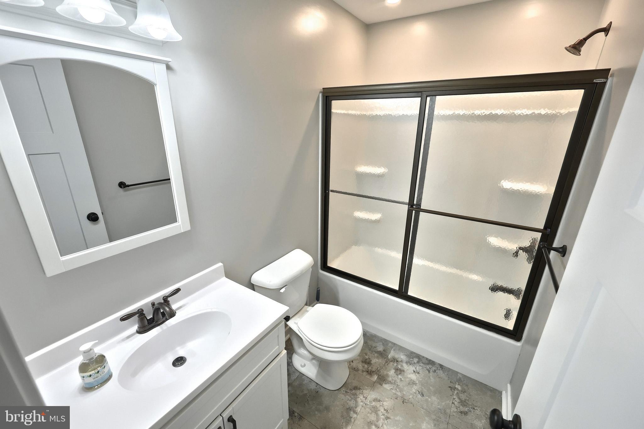 55 Cardinal Drive Hanover, PA 17331 - Photo 30 of 53 a bathroom with a sink mirror vanity and toilet